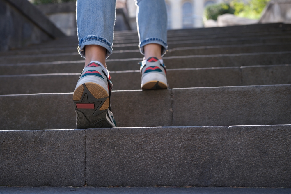 girl walking up the steps